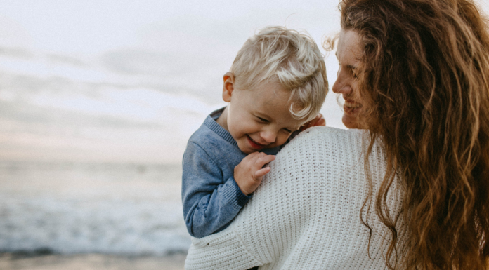 A mother holding her son.