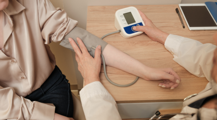 Taking someone's blood pressure.