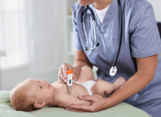 A pediatrician examining a baby.