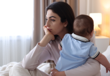 A woman holding her baby.