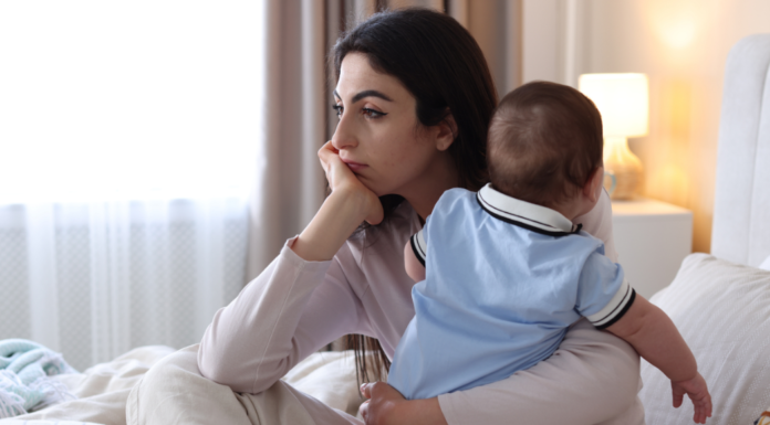 A woman holding her baby.