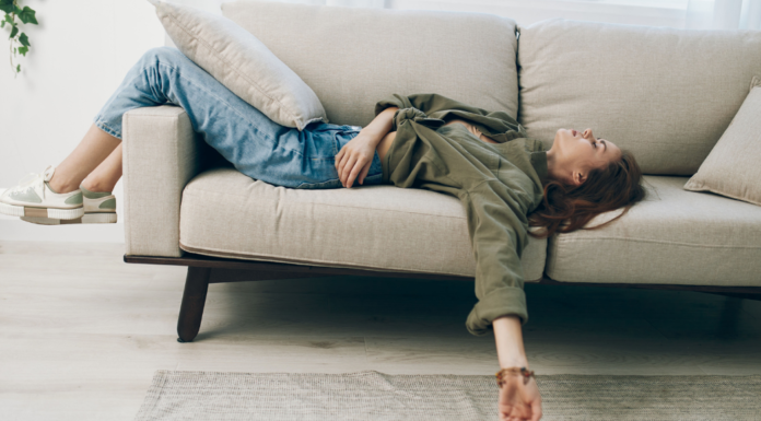 My Ugly Truth: I’m a Lazy Mom and I’m OK With That A woman laying on the couch.