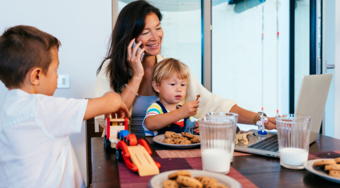 Rules Are Made To Be Broken A mom with her kids trying to work at the kitchen table.