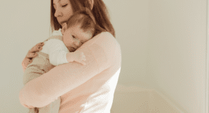 Woman holding a bsby.