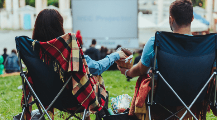 A couple at an outdoor movie.