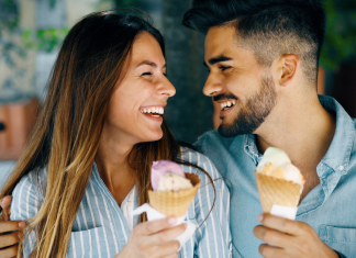 A couple eating ice cream.