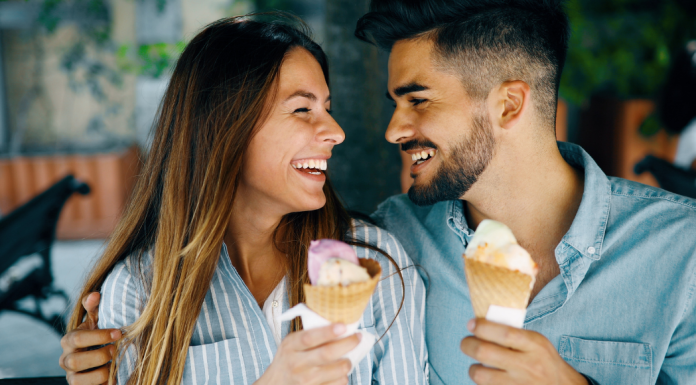 A couple eating ice cream.