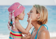 Summer Mode Mom A daughter putting sunscreen on her mom's face.