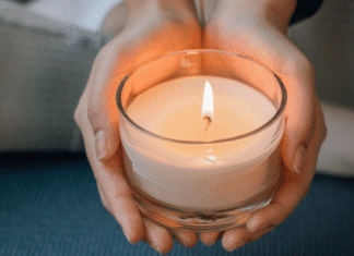 Pregnancy and Infant Loss Remembrance Day A woman holding a candle.