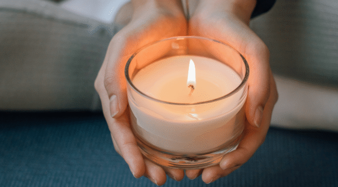 A woman holding a candle.