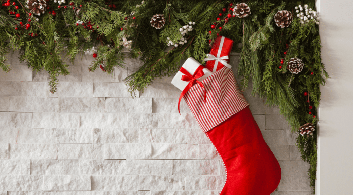 Christmas stocking hanging from a mantle.