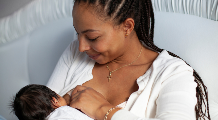 A woman breastfeeding her baby.