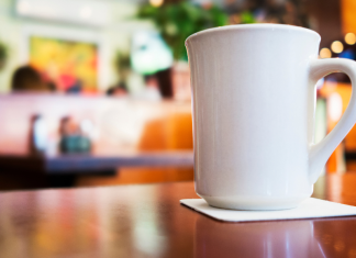 A coffee cup on a diner counter.