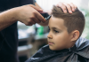 A boy getting a haircut.