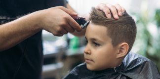 A boy getting a haircut.
