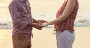 A man and a woman holding hands.