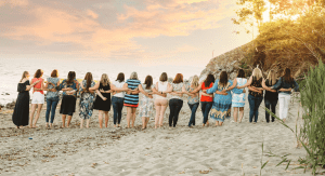 The Fairfield County Mom team with their arms around one another. 