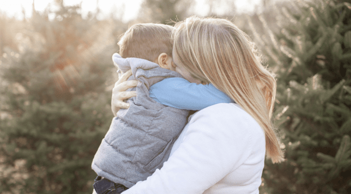 Mom hugging her son.