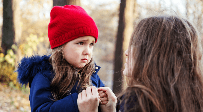 A child trying to speak to an adult.