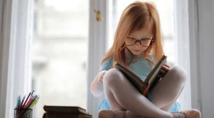 A girl reading a book.