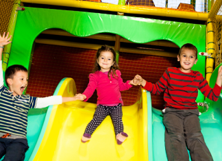 Kids on an indoor slide.