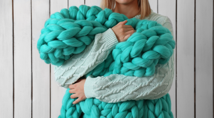 A woman holding a blankie.