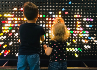 20 Must-Visit Museums in and Around Fairfield County Kids playing with colored pegs at a local children's museum.