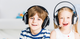 A boy and a girl wearing headphones.