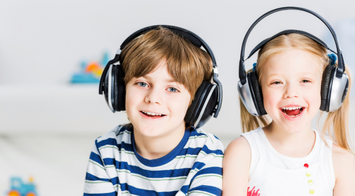A boy and a girl wearing headphones.