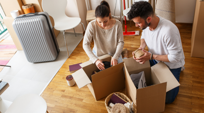 A couple packing for a move.