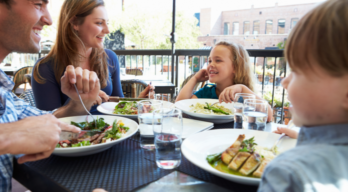 A family dining in an outdoor restaurant.