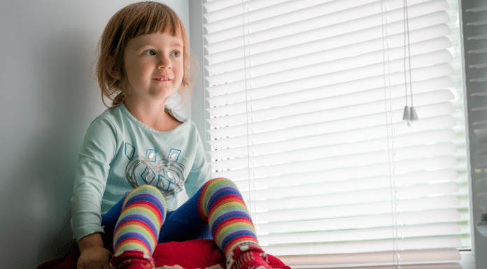 A girl sitting in time out.