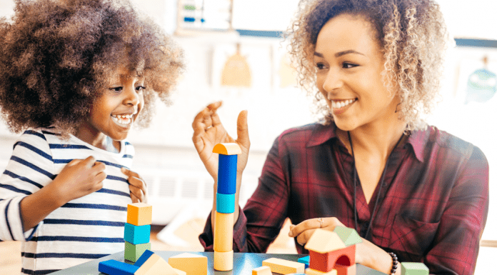 A mom playing blocks with her daughter