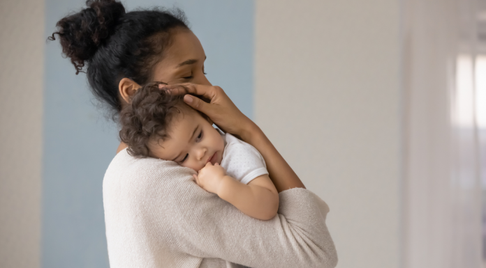 A woman holding her baby.