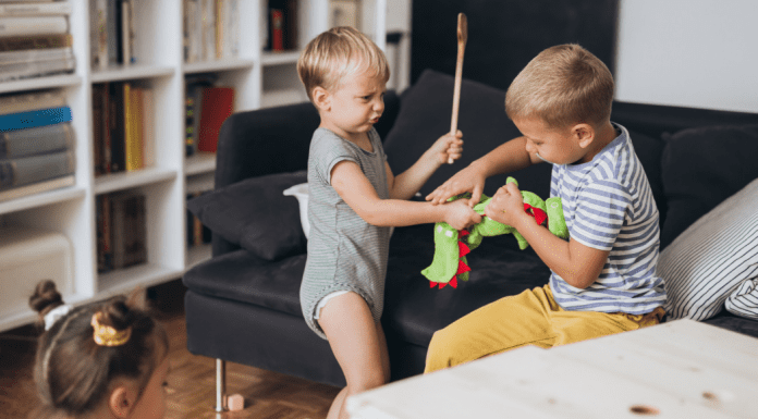 Two siblings fighting.
