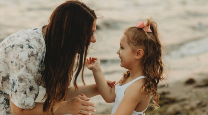 A mom talking to her daughter.
