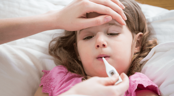 A sick child with a fever.