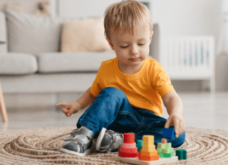 A boy playing with toys.