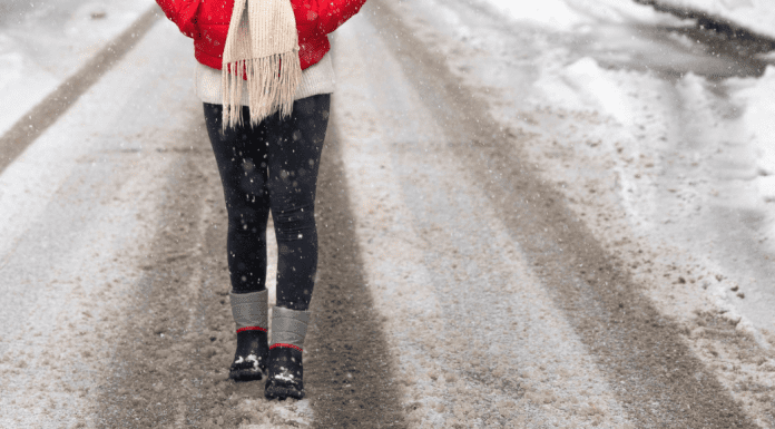 Walking in the road in the snow.