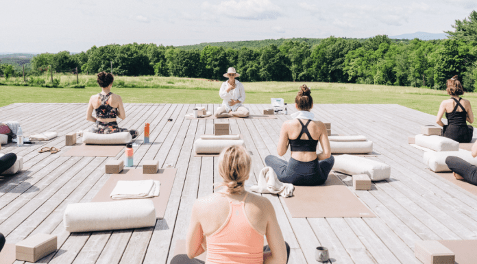 Women on an outdoor yoga retreat.