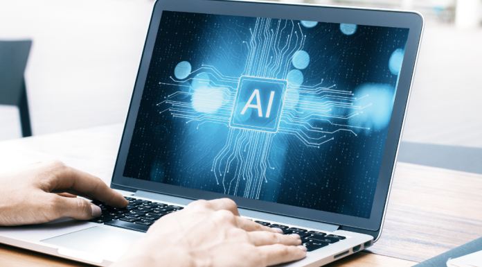 A person using AI on a lap top.