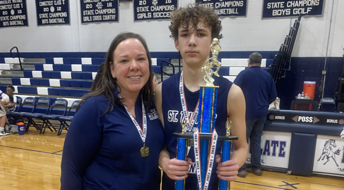 A mother coaching her son's basketball team.
