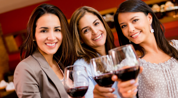 Women celebrating with wine.