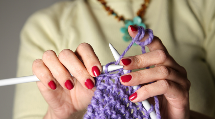 A woman knitting.