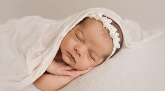 A newborn sleeping during a photography session.