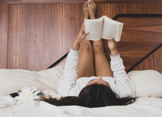 A woman reading in bed.