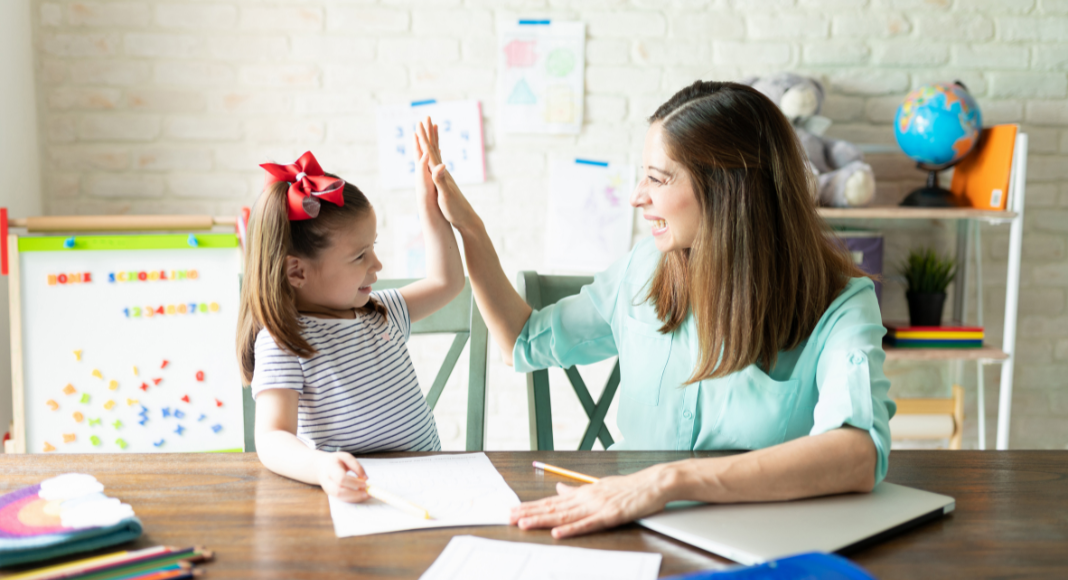 A mom homeschooling her daughter following organizational tips.