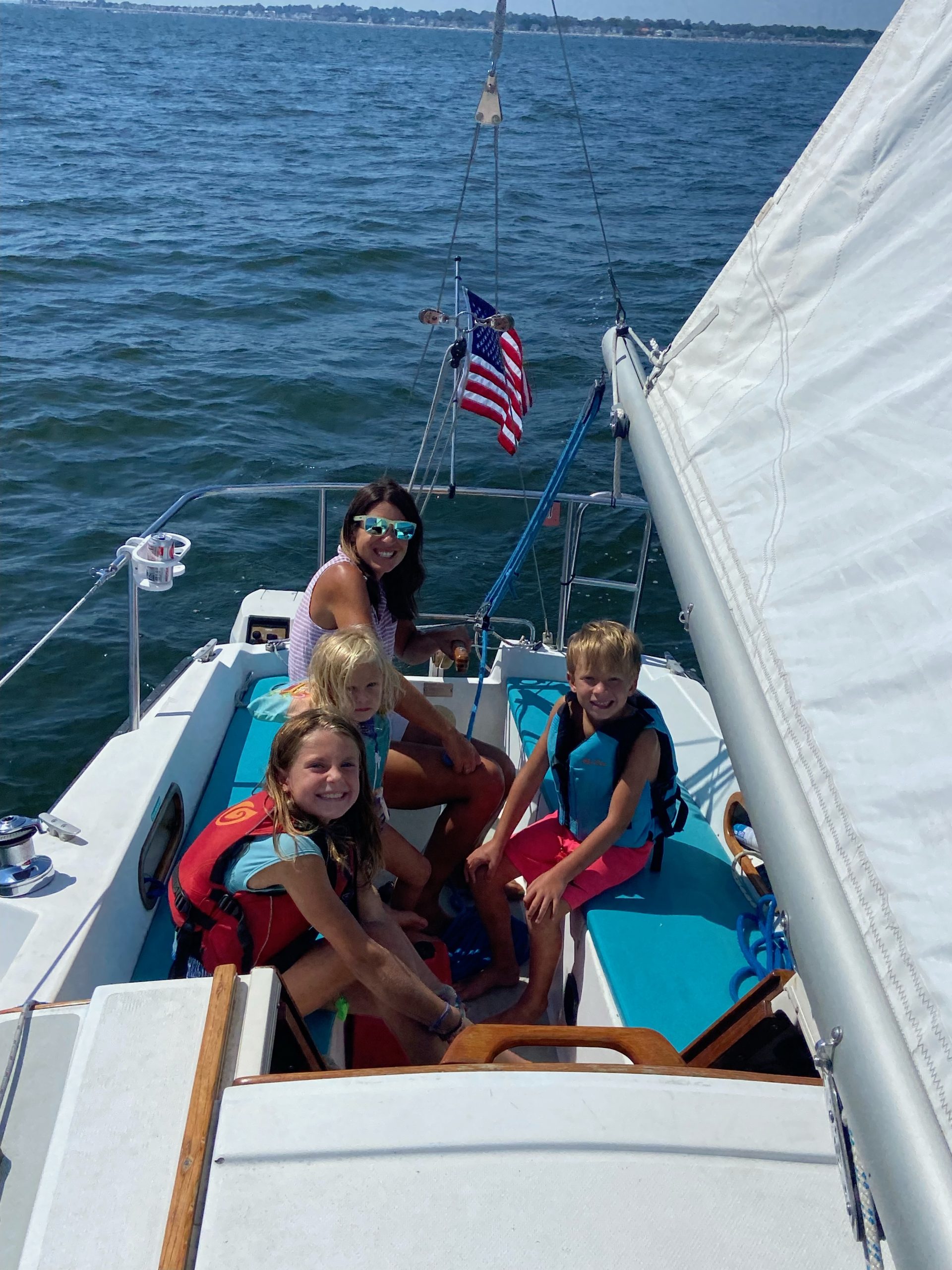 A family on a sailboat.