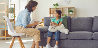 A child speaking with a therapist.