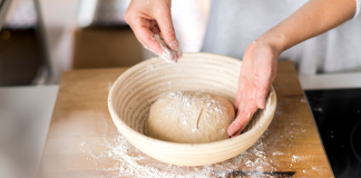 Sprinkling flour on bread dough.